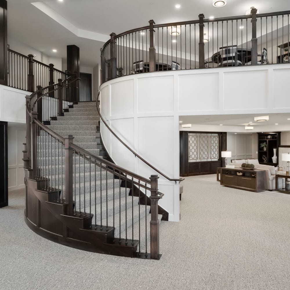 Lobby staircase at Applewood Pointe of Westminster in Westminster, Colorado.