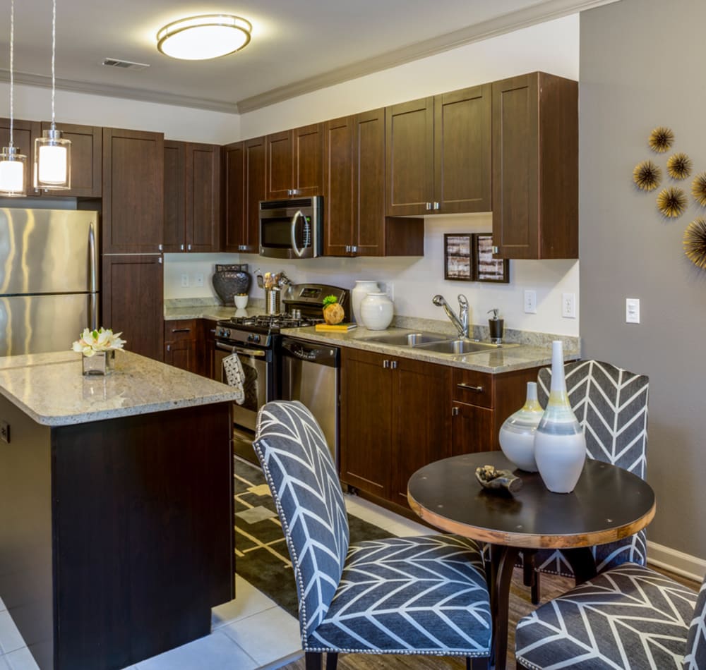 Modern kitchen with granite countertops at 17 Barkley in Gaithersburg, Maryland