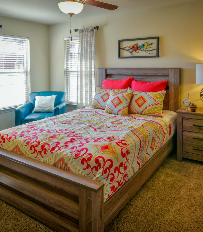 Chic bedroom with ceiling fan at The Icon at Lubbock in Lubbock, Texas