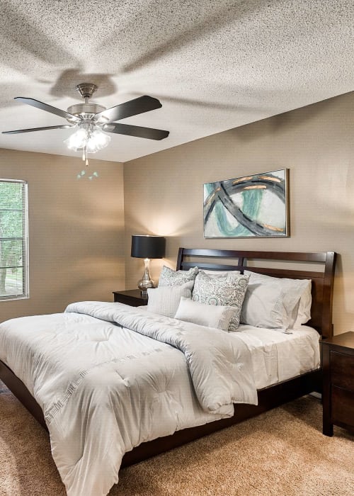 Bedroom with plush carpeting at Knollwood in Mobile, Alabama