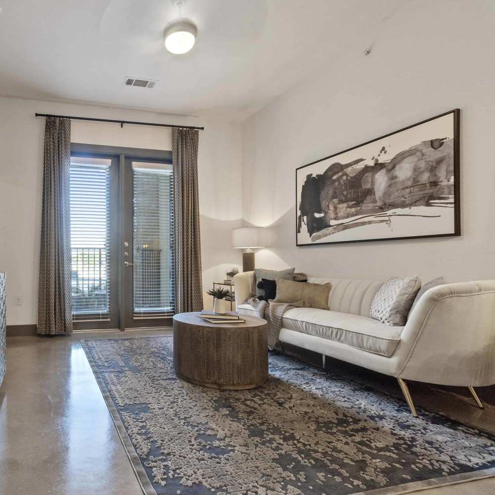 Living room with a couch at Millennium Place in Corinth, Texas