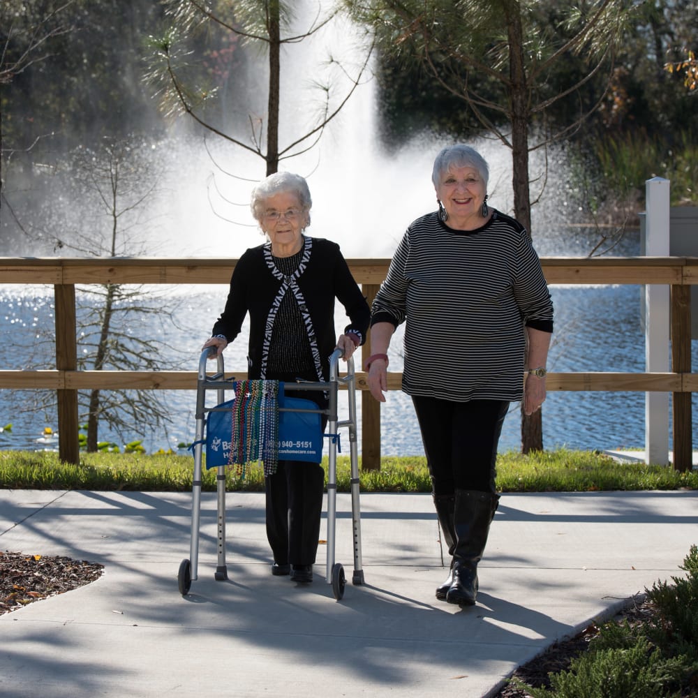 A resident couple out for a walk near an Inspired Living community.