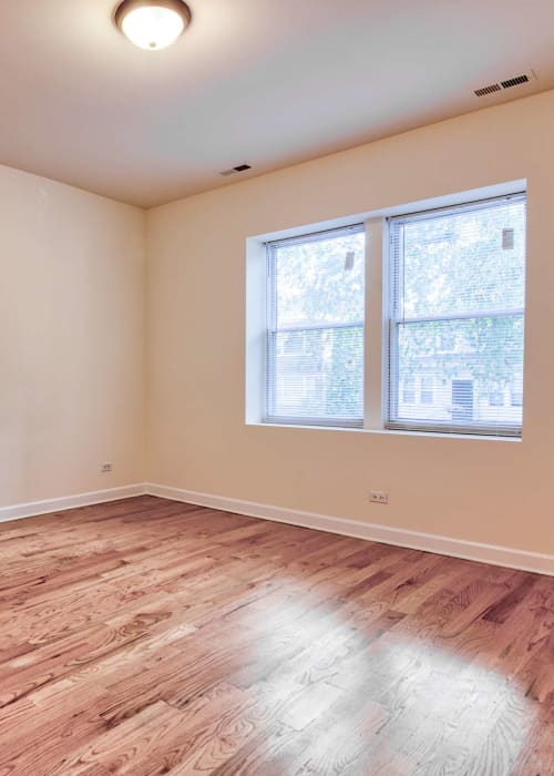 Bedroom with wood-style flooring at The Maynard at 3348 W Wilson in Chicago, Illinois