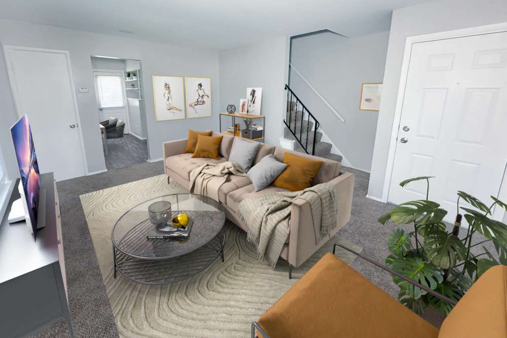 Living room with carpet flooring at Eden Green Townhomes in Columbus, Ohio