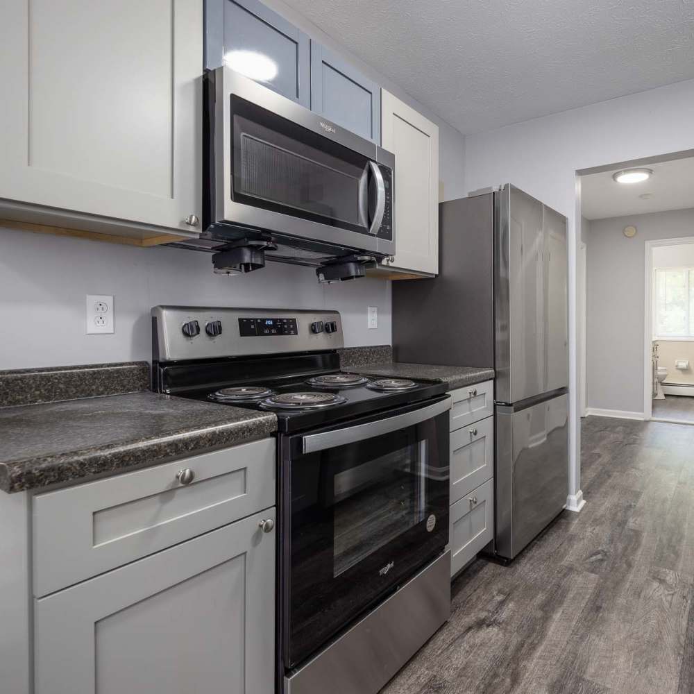 White kitchen at Oakwood Manor Apartments in Fairport, New York