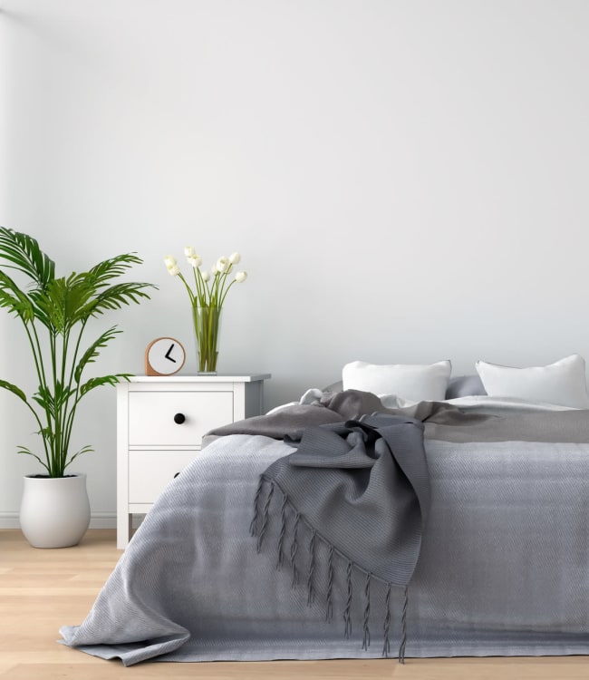 Cozy bedroom at Wayland Village Senior Apartments in Baltimore, Maryland