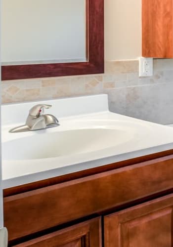 Elegant wood detailing in bathroom at Pompton Gardens in Cedar Grove, New Jersey