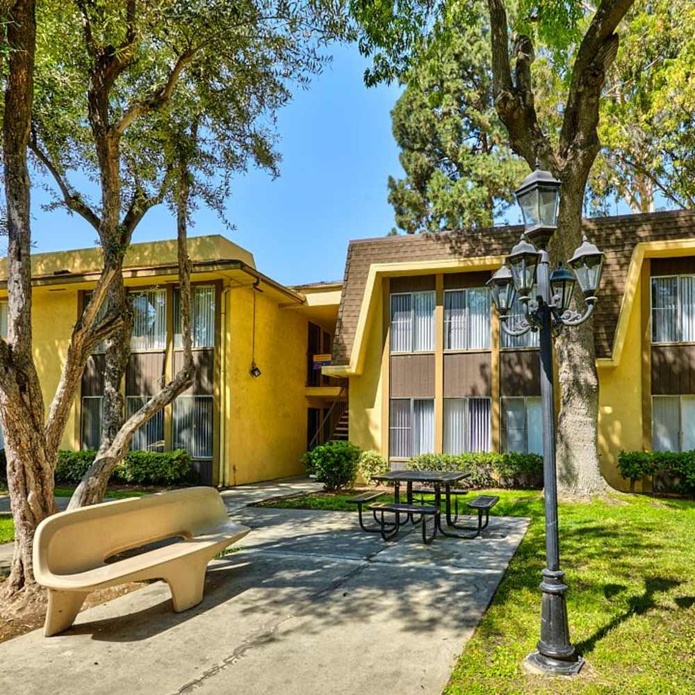 Seating area outside community apartment at Las Lomas Gardens in La Habra, California