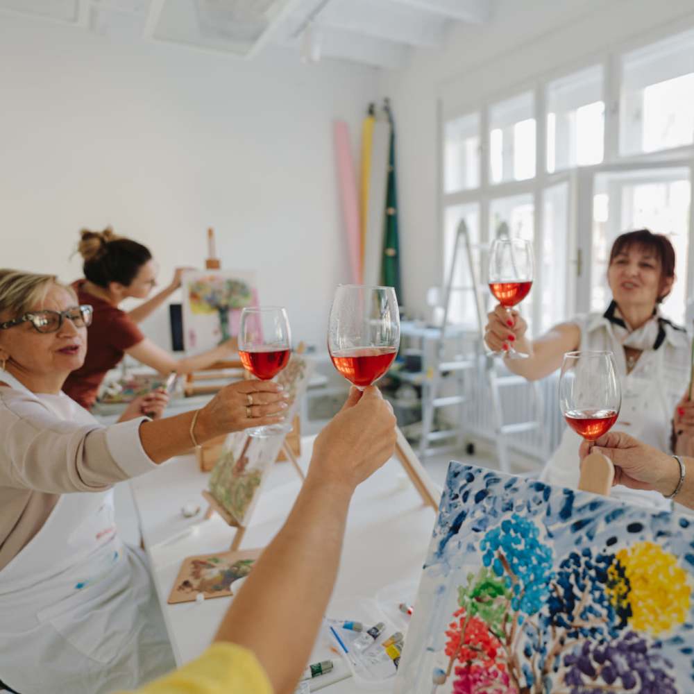 Residents participating in a painting class at Clearwater Living in Newport Beach, California