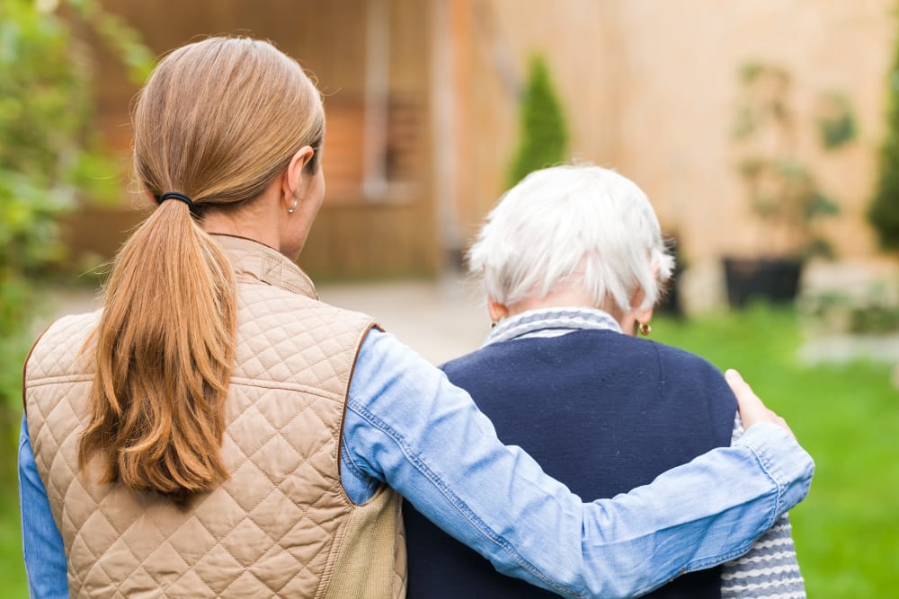 Resident with a family member at Addington Place of Collinsville in Collinsville, Illinois