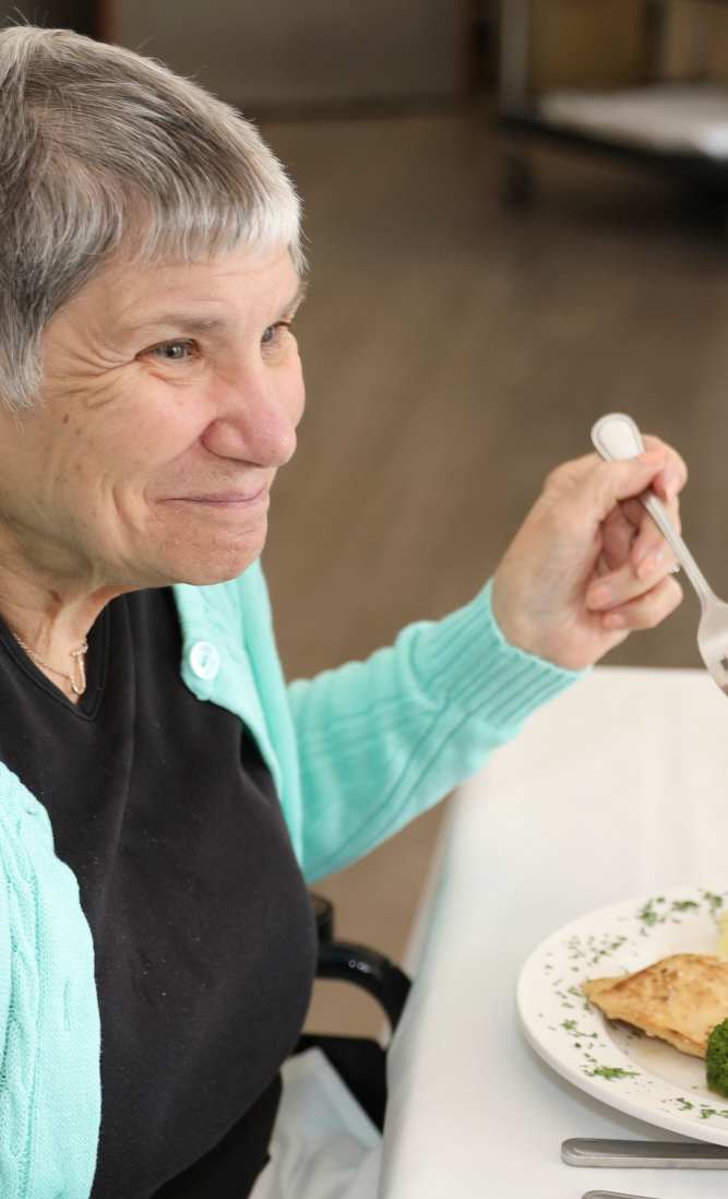 Resident enjoying a meal at Dougherty Ferry in Valley Park, Missouri