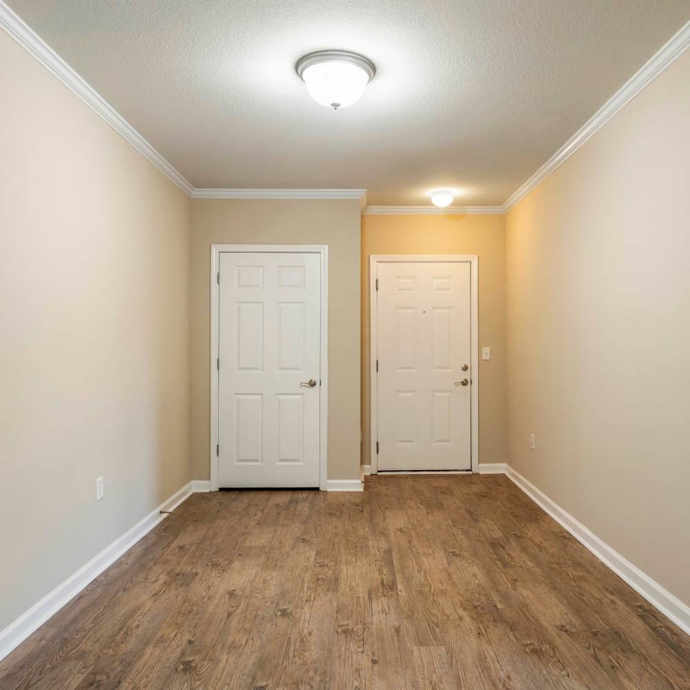 Apartment entryway with wood-style flooring at Chenal Pointe at the Divide in Little Rock, Arkansas