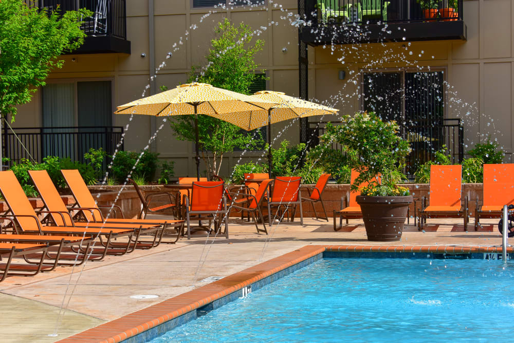 Lounge chairs surround the swimming pool at South Ridge in Greenville, South Carolina