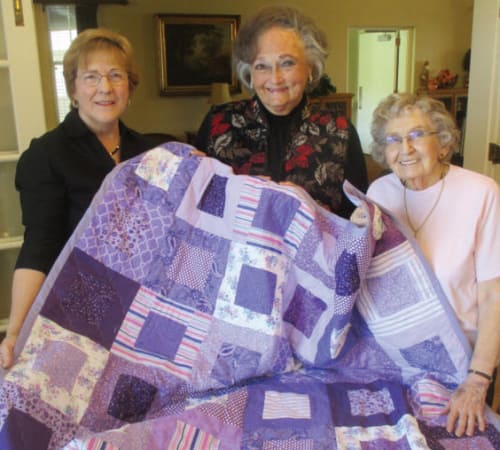 Happy senior woman enjoying birthday at Eastern Star Masonic Retirement Campus in Denver, CO