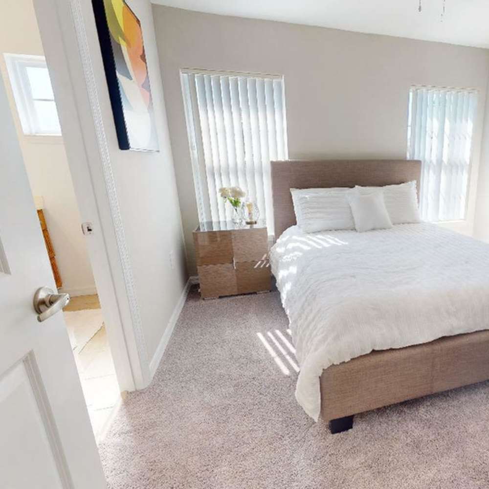 A cozy bedroom at The Reserve at Brookhaven in Palm Coast, Florida