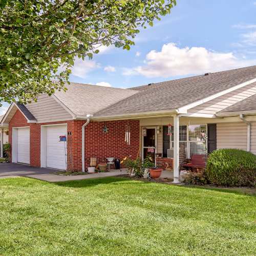 Beautiful exterior view of the apartment home showing a porch area at Heritage Greene in Washington Court House, Ohio