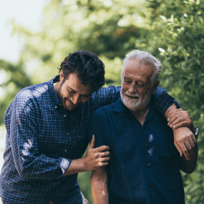 Resident and son walk together at Milestone Retirement Communities 