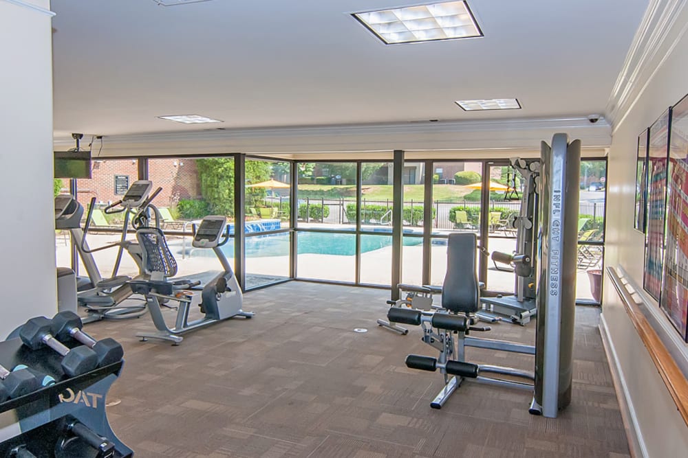 Fitness center looking over the pool at Greenleaf Apartments in Phenix City, Alabama