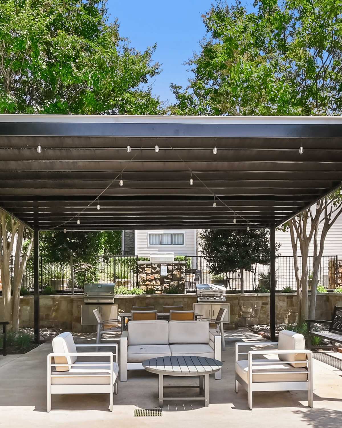 Covered seating in the park at Arbor Hills at Flatiron District at Austin Ranch in The Colony, Texas