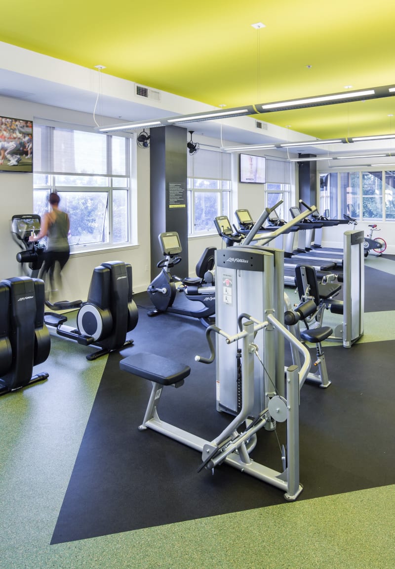 Residents staying in shape in the fitness center at Sofi at 50 Forest in Stamford, Connecticut