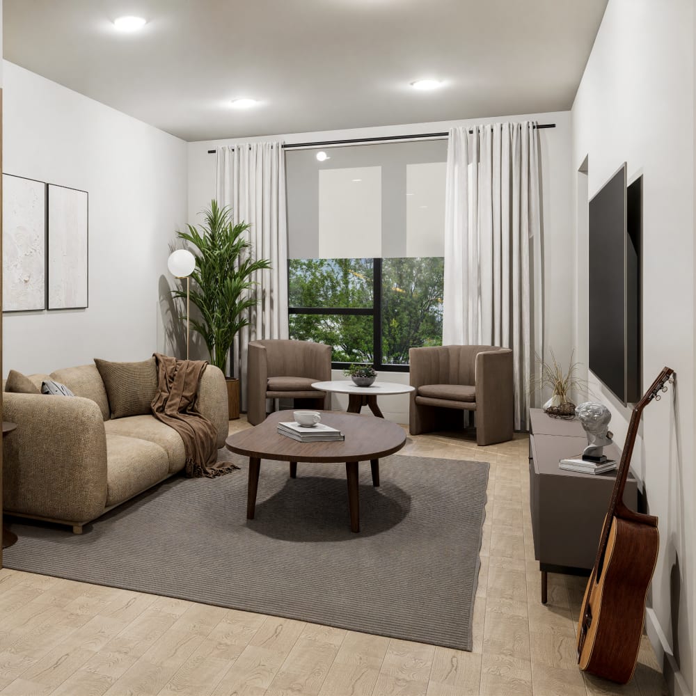 Sunlit living room with cozy seating and modern decor at Bellwood Gateway Apartments in Bellwood, Illinois
