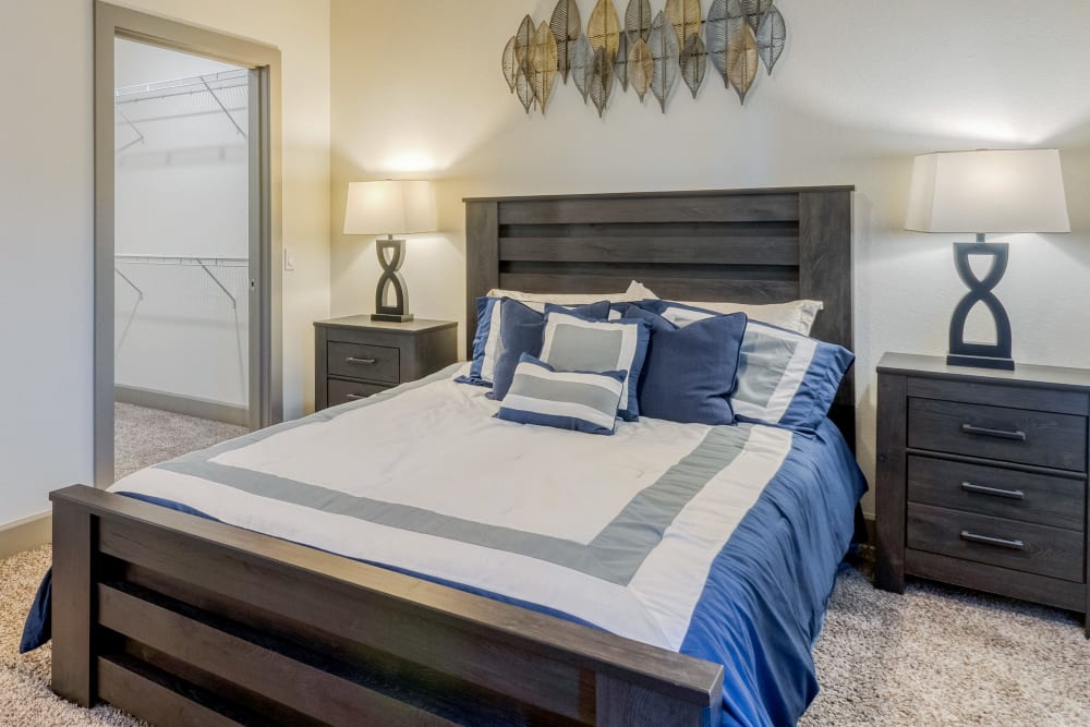 Bedroom with walk-in closet at Enchanted Springs Apartments in Colorado Springs, Colorado