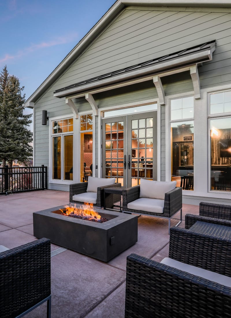 Outdoor sitting area with a fire pit at Marquis Castle Pines in Castle Pines, Colorado