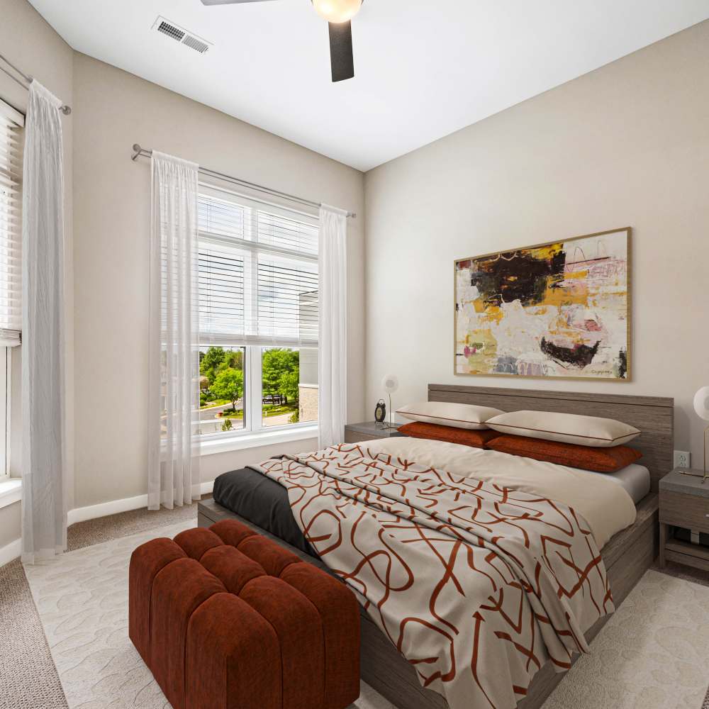 Bedroom with cozy bed and beautiful wall art at Neo Vantage Point in Maryland Heights, Missouri