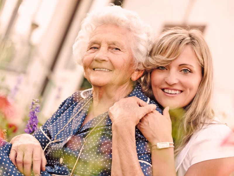 Resident and her daughter outside enjoying the sun at The Residences on Forest Lane in Montello, Wisconsin