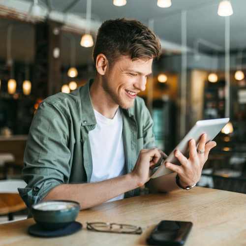 Man sitting at a cafe near Fletcher Black in Panama City, Florida
