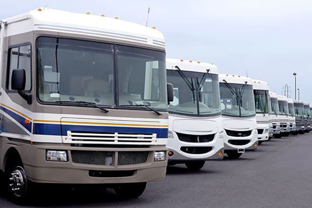 RVs parked in an organized row at Port Storage in Tillamook, Oregon