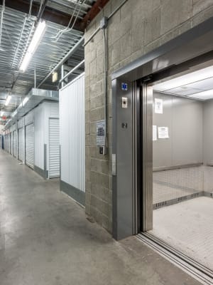 A large elevator and storage units inside Nova Storage in Los Angeles, California