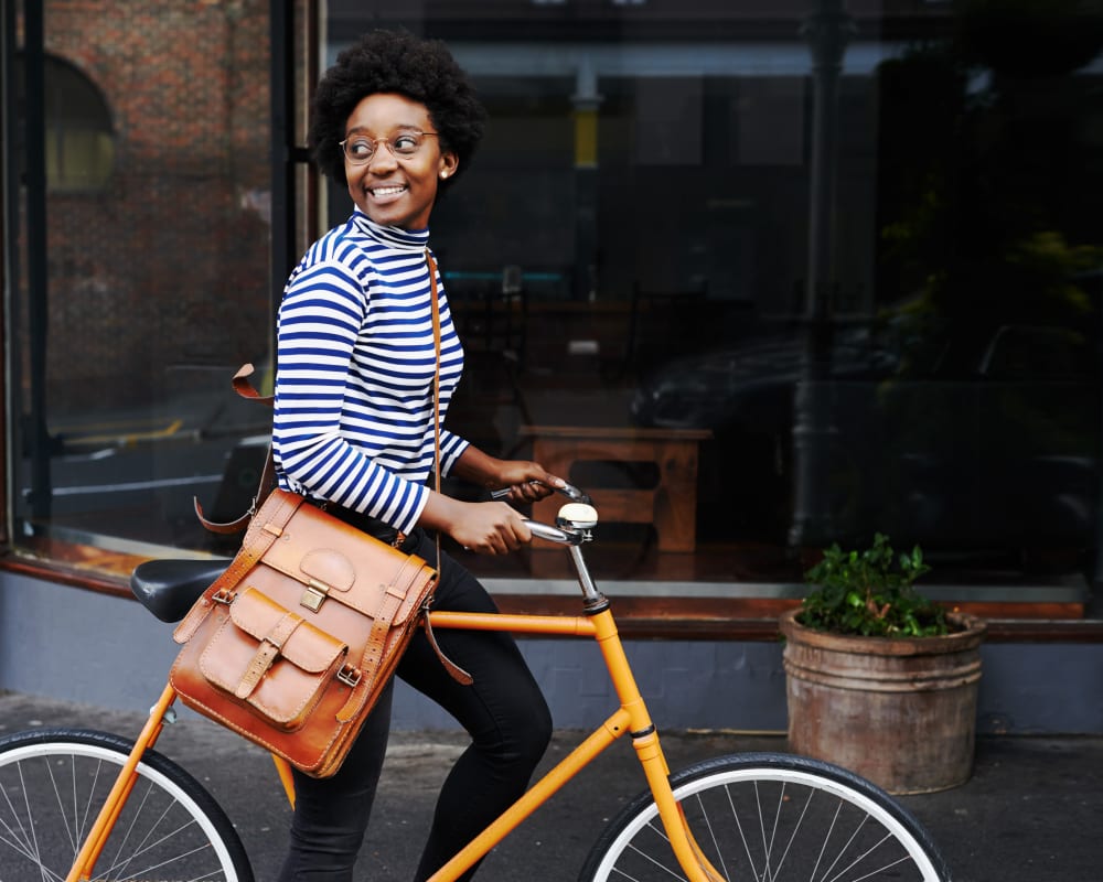 Resident riding her bike through the city near at Sofi Warner Center in Woodland Hills, California