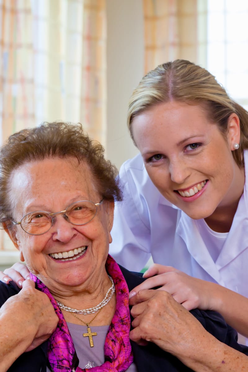 Resident and a nurse smiling at Maple Ridge Care Center in Spooner, Wisconsin