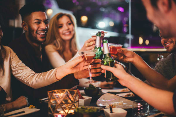 Resident raising a toast to the good life at Alexan Park West in Peoria, Arizona