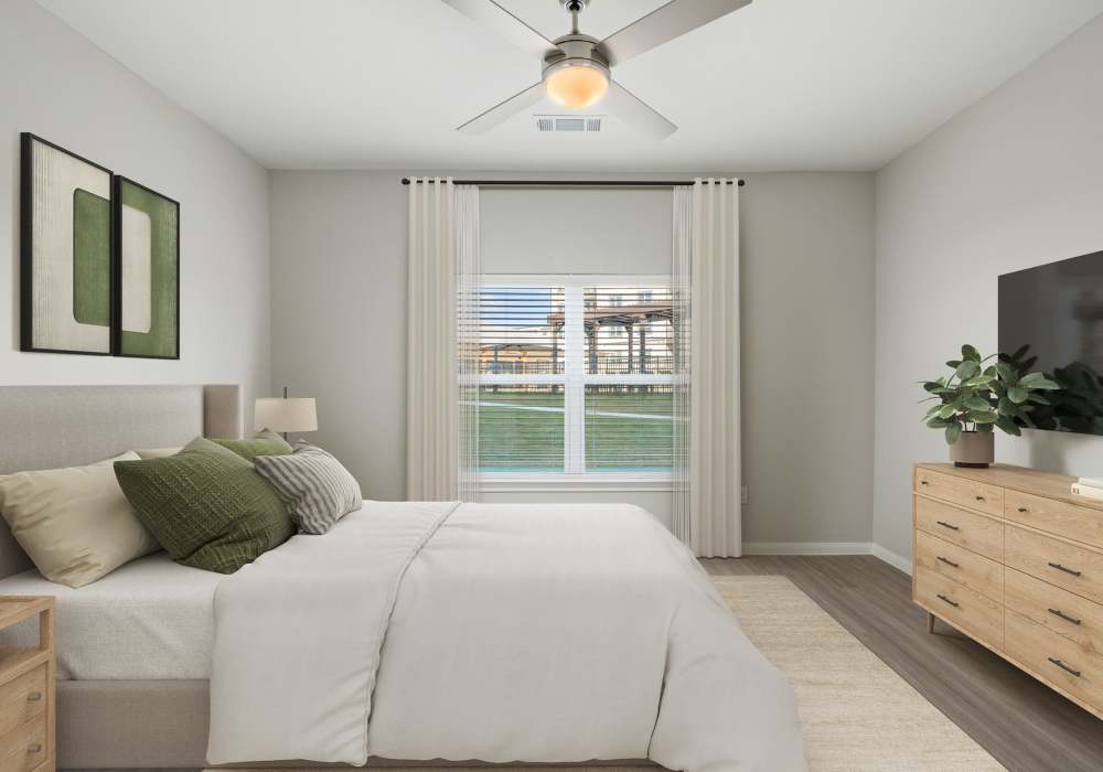 Cozy bedroom with natural light at Oak Creek in New Braunfels, Texas