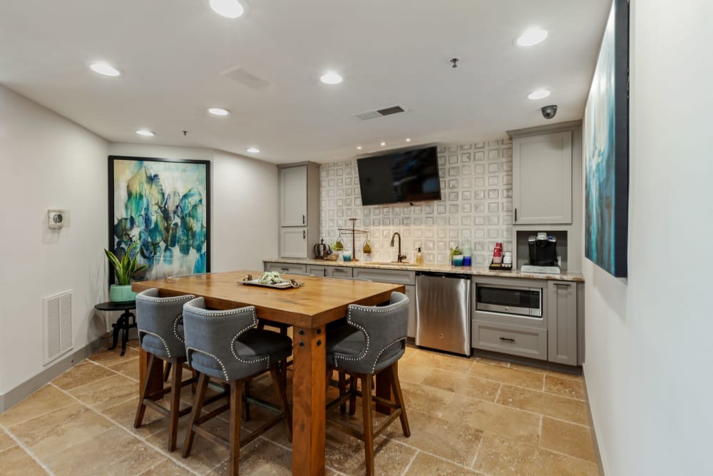 Modern kitchen and dining area with tile flooring at 45Eighty Dunwoody Apartment Homes in Dunwoody, Georgia