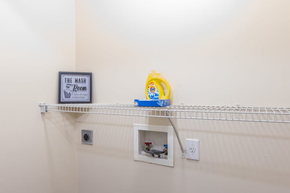 Utility room with washer and dryer connection at Ashton Walk in Forest Park, Georgia