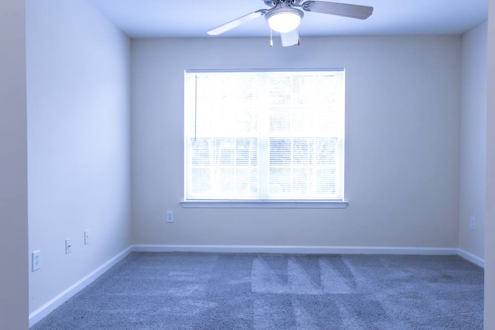Unfurnished bedroom with large window at Ashton Walk in Forest Park, Georgia