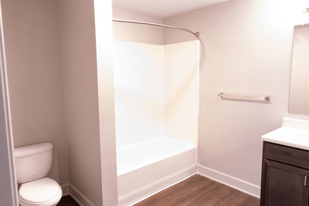 Bathroom with commode and bathtub at Villas At Mount Zion in Stockbridge, Georgia