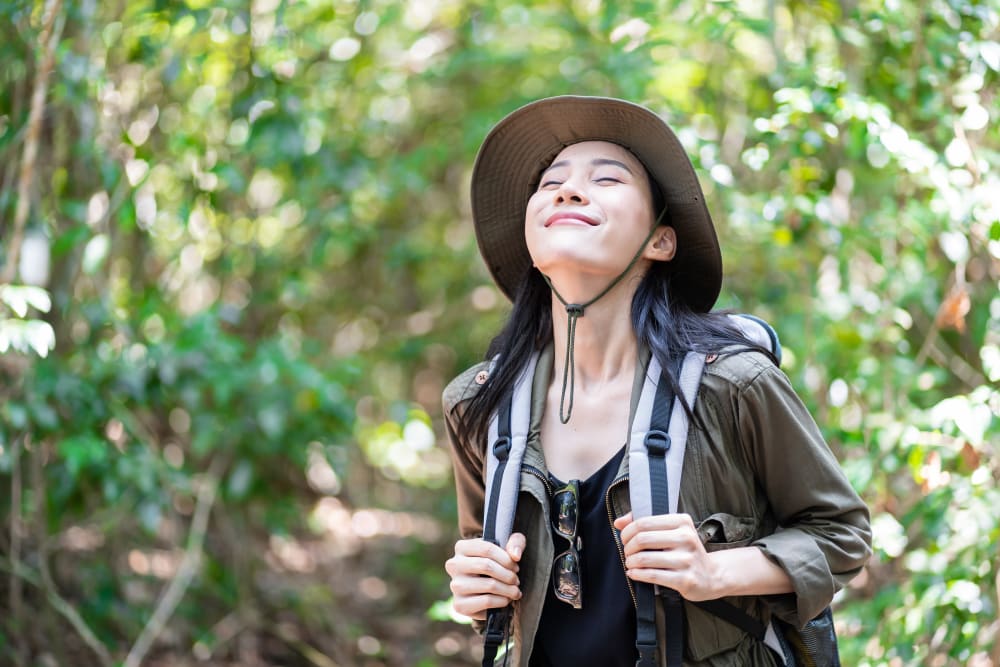 Resident smiling while on a hike near Lattitude34 Dillard Creek in Greer, South Carolina