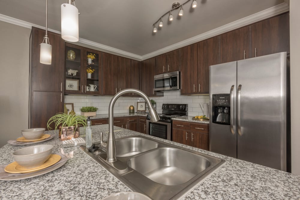 Modern kitchen and appliances at The Abbey at Dominion Crossing in San Antonio, Texas