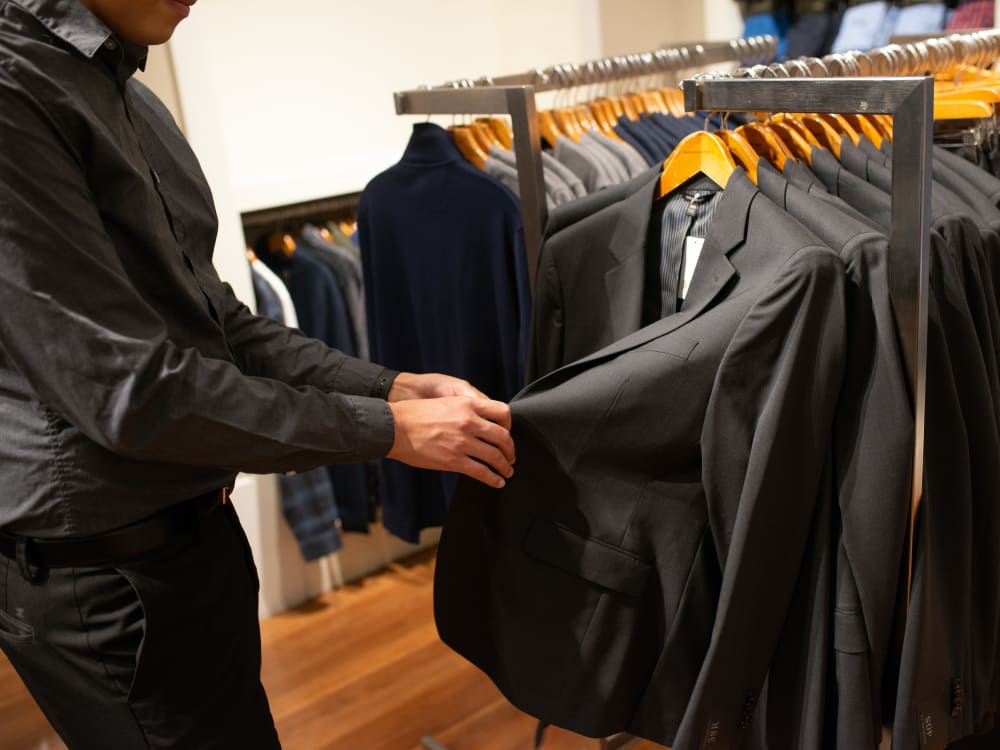 Resident enjoying shopping for a suit near San Palacio in Chandler, Arizona