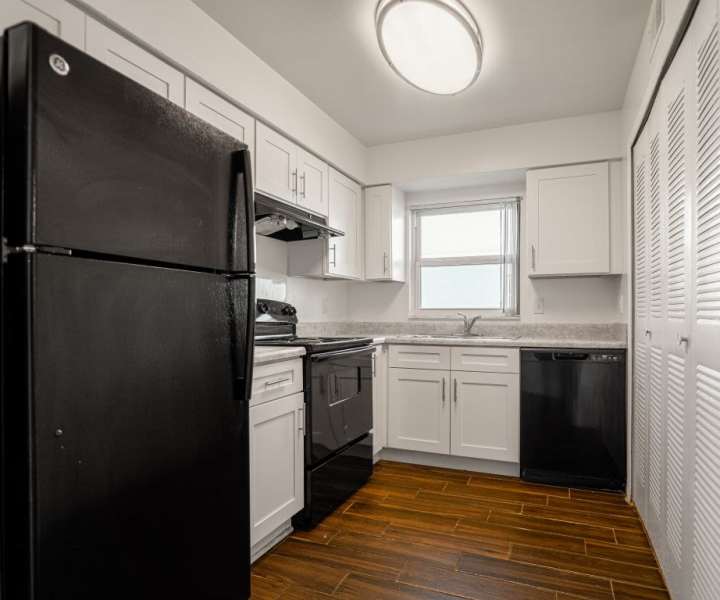 Kitchen with refrigerator at Dunwoodie Place in Orlando, Florida