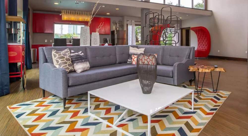 Clubhouse with comfortable couch at Barcelo Apartment Homes in San Antonio, Texas