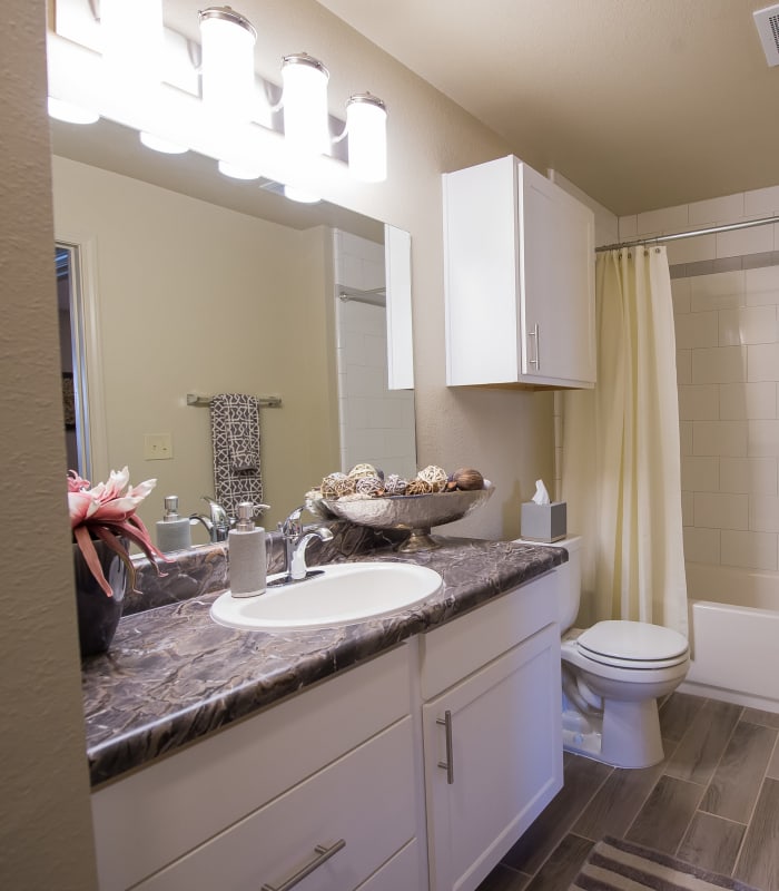 Bathroom with tile flooring at Mission Point Apartments in Moore, Oklahoma