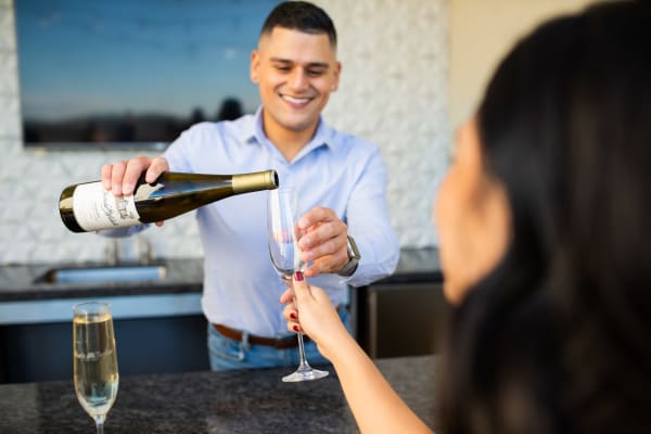 Man pouring a glass of wine at The Palms on Scottsdale in Tempe, Arizona