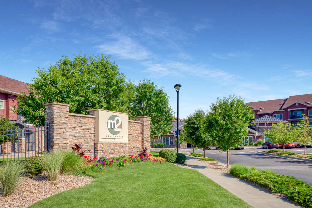 Property signage board at M2 Apartments in Denver, Colorado