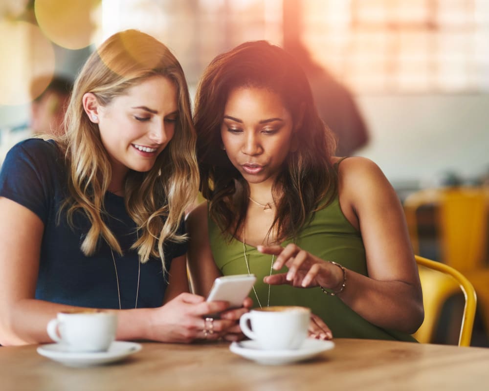 Friend getting coffee together near Two50 Downtown in San Mateo, California