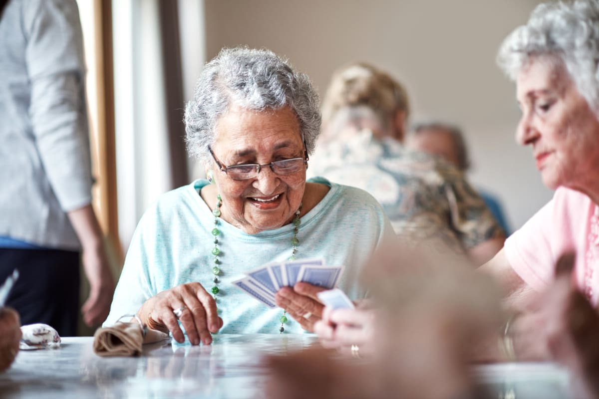 Residents playing a game together at Canoe Brook Assisted Living & Memory Care in Catoosa, Oklahoma